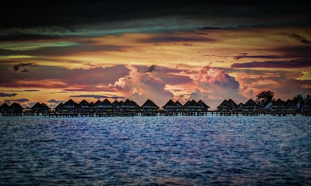 Ovation Global DMCs has opened an new office in Tahiti. Image here shows the island of Bora Bora at sunset. Photo by Michelle Raponi | Canva.